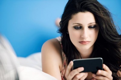 1486835977Teenage-girl-using-mobile-phone-on-bed.jpg